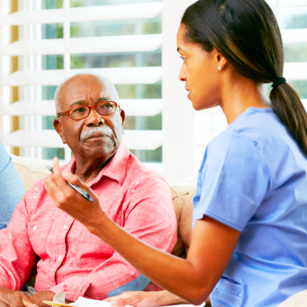 caregiver and senior man talking