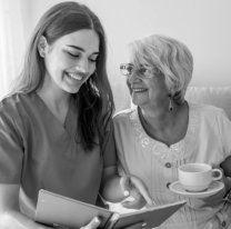 happy caregiver and senior woman