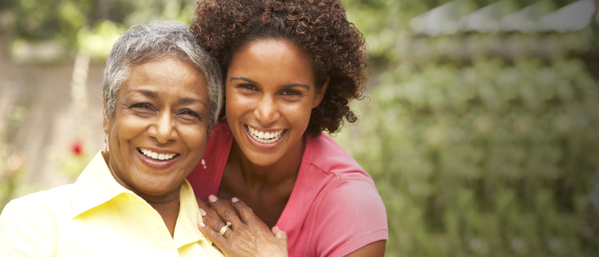 adult woman and senior woman smiling