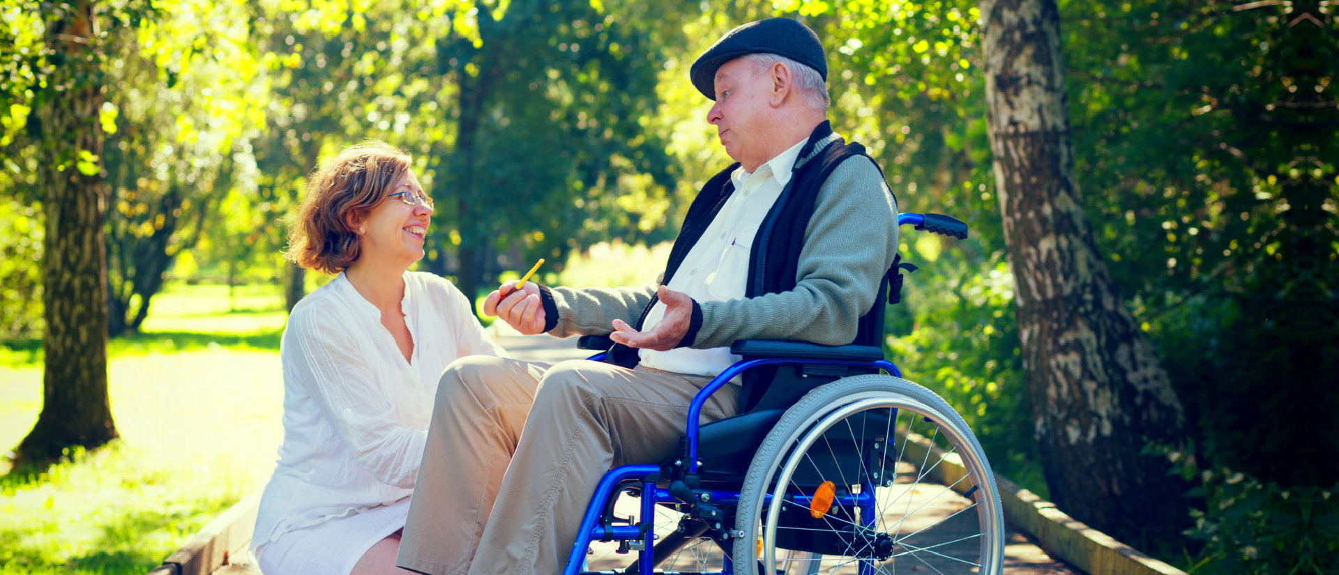 adult woman and senior man having a conversation