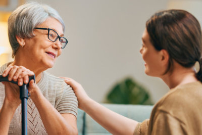 caregiver holding senior woman